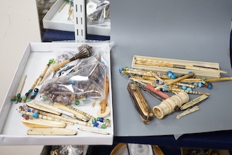 A collection of 19th century bone and ivory mounted penknives, bobbins etc